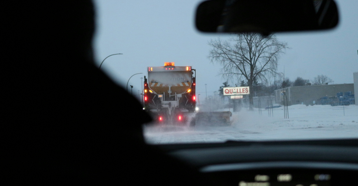 a car driving on a snowy road