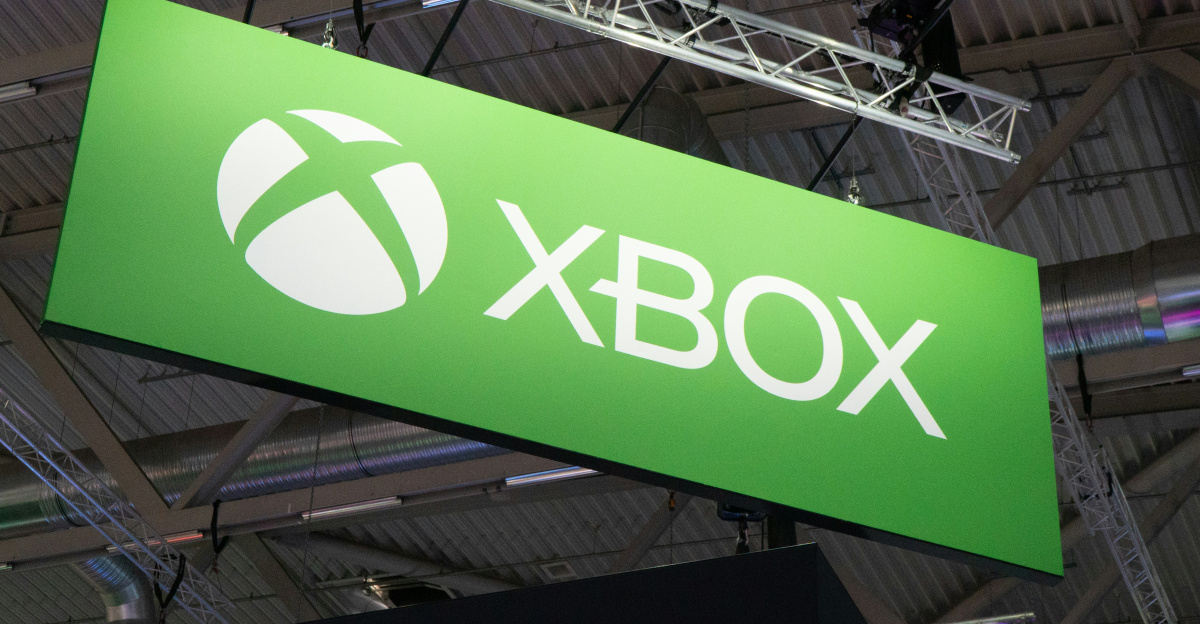 a large green sign hanging from the ceiling of a building