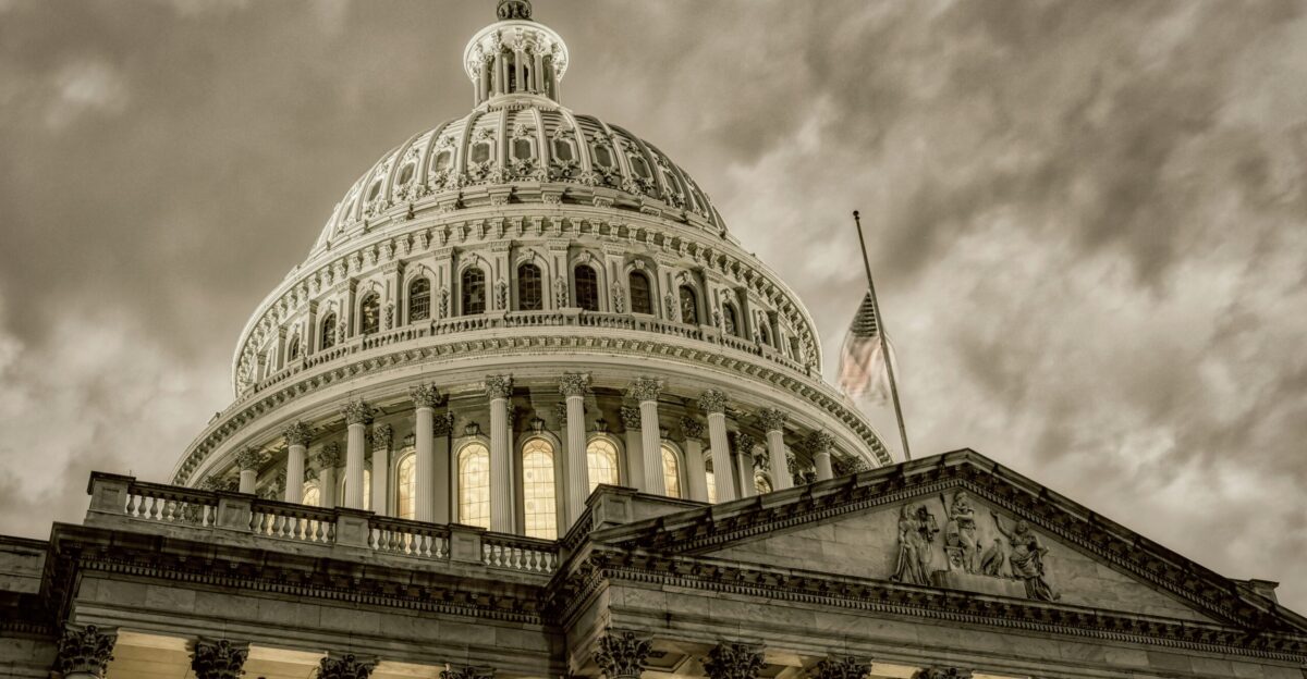 a large white building with a flag on top