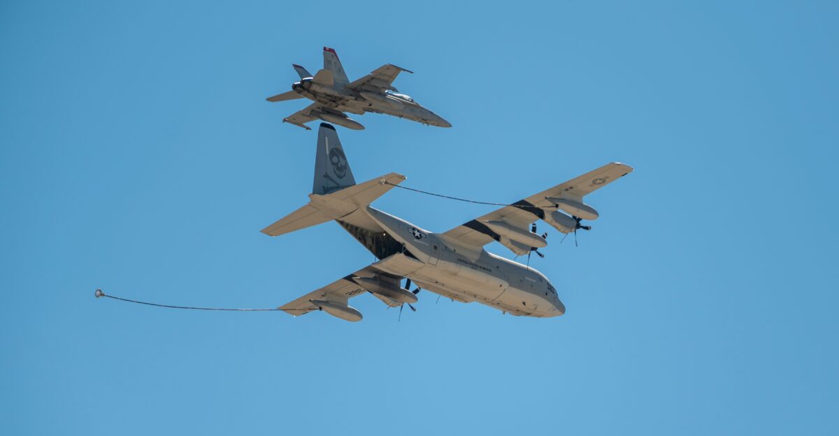 a couple of airplanes flying in the sky
