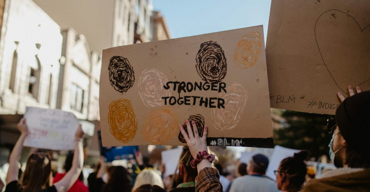 a group of people holding signs