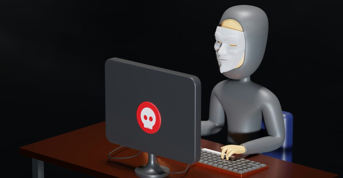 a person sitting at a desk with a computer