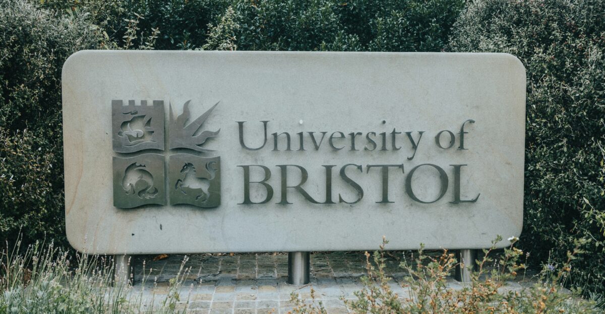 a sign in front of bushes