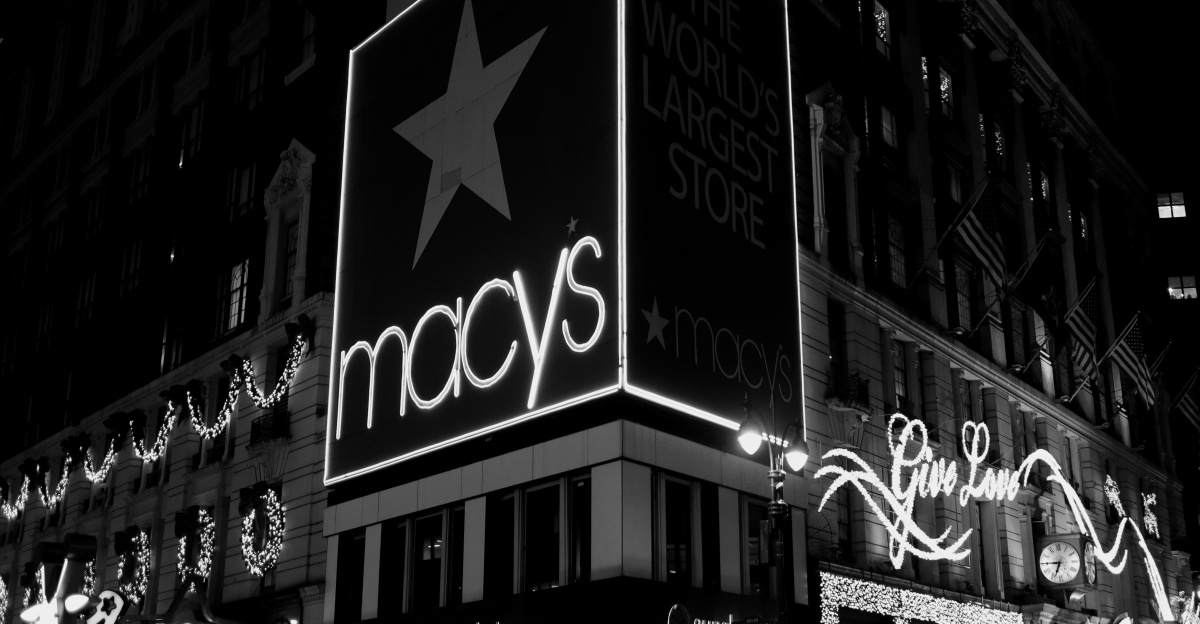 a black and white photo of macy's at night