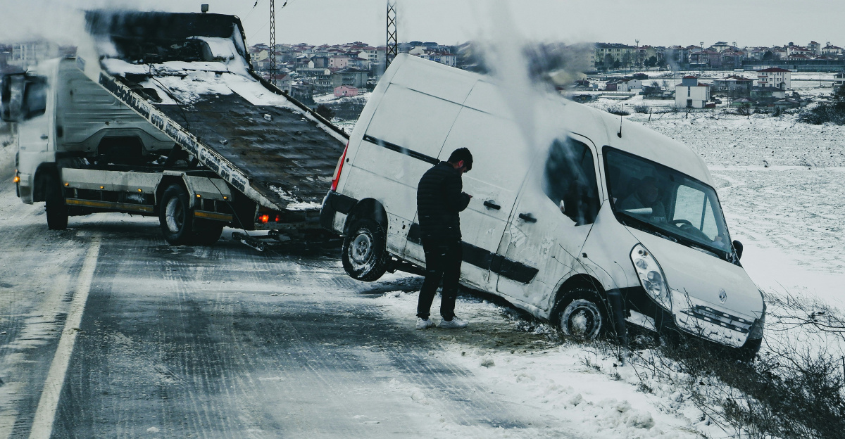a man standing next to a white van on the side of a road
