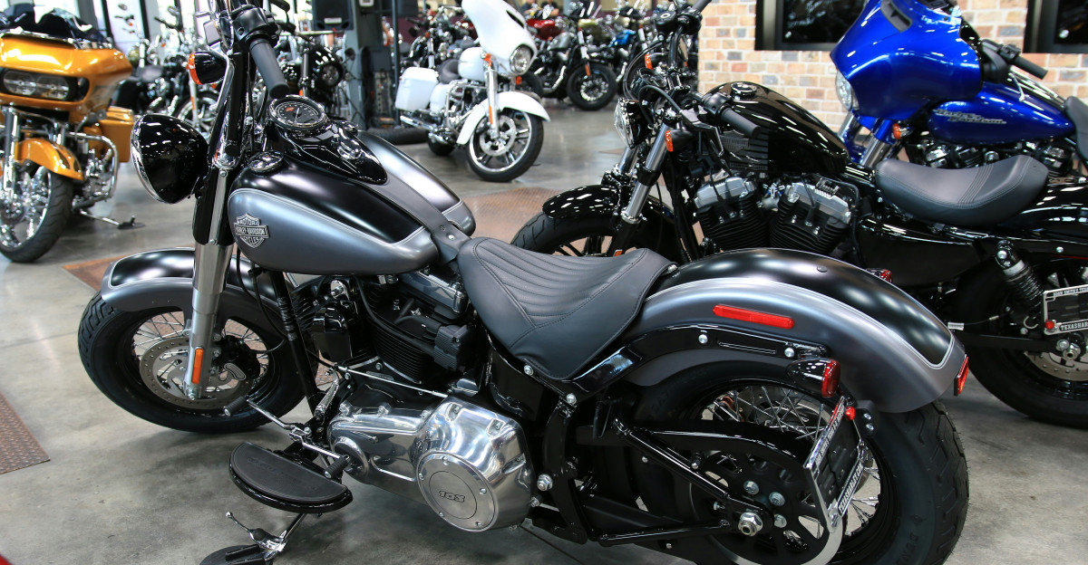 a group of motorcycles are parked in a showroom