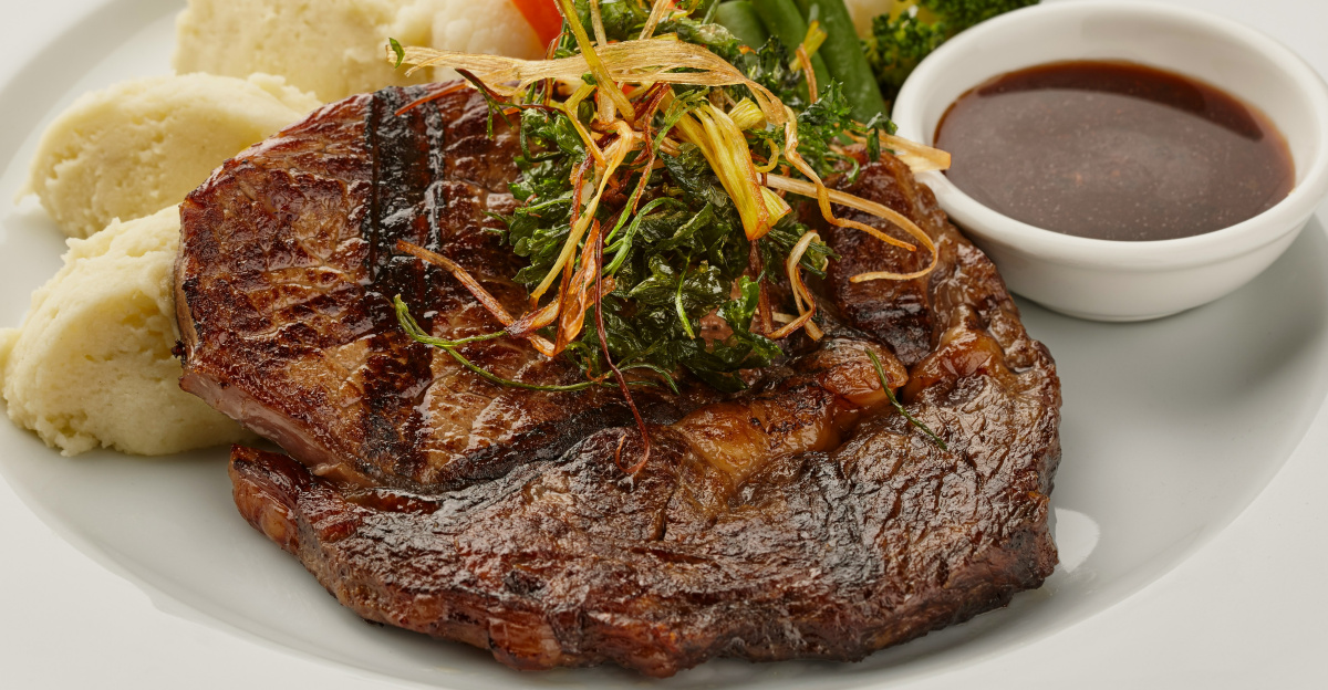 a white plate topped with steak, potatoes and broccoli