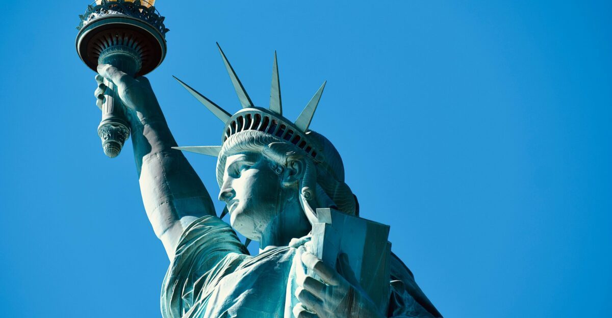 the statue of liberty is holding a torch in its hand