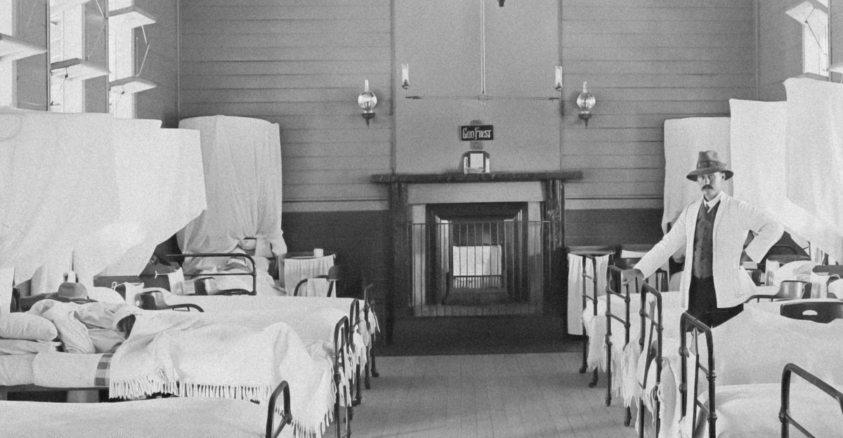a black and white photo of a hospital room