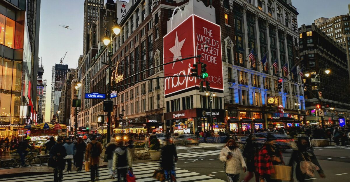 a group of people crossing a street at a crosswalk
