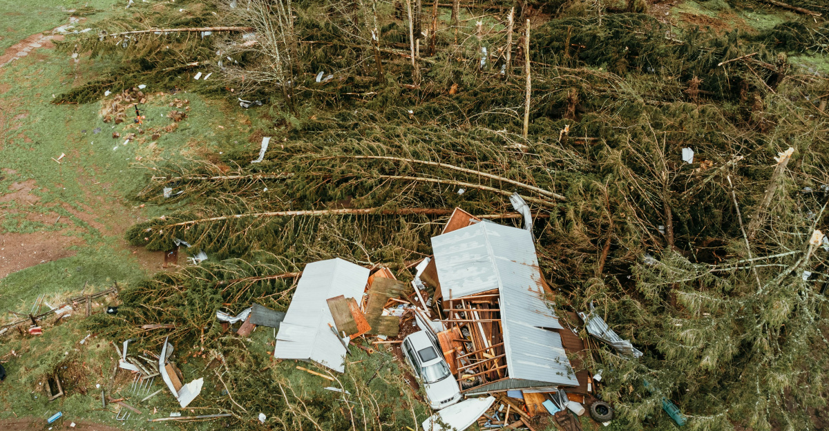 a house that has been torn down in the middle of a field