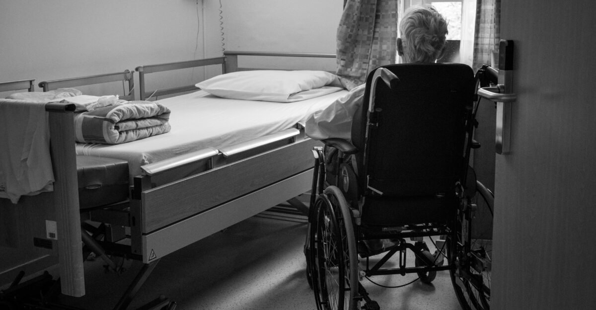a person in a wheelchair in a room