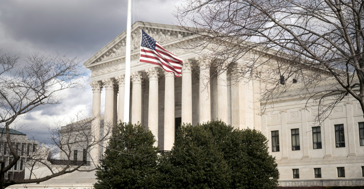 a large building with a flag on top of it