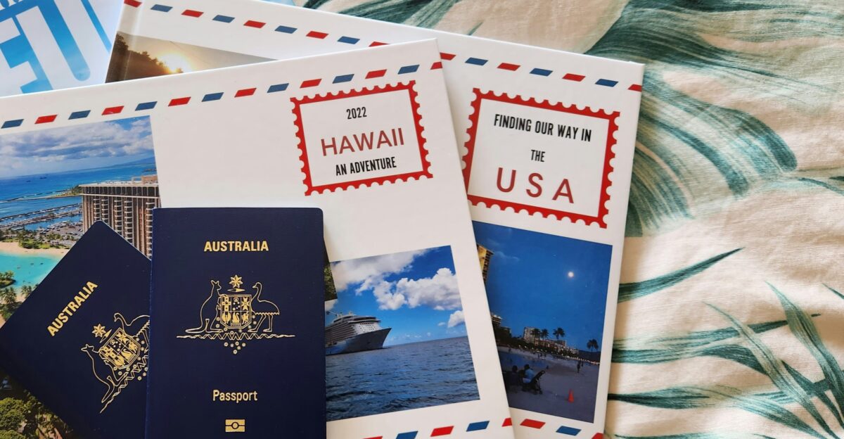 a couple of passports sitting on top of a bed