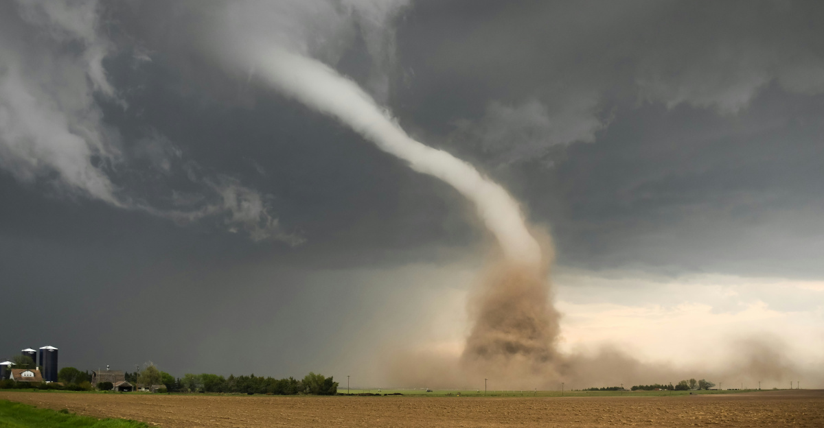 a large tornado is coming out of the sky