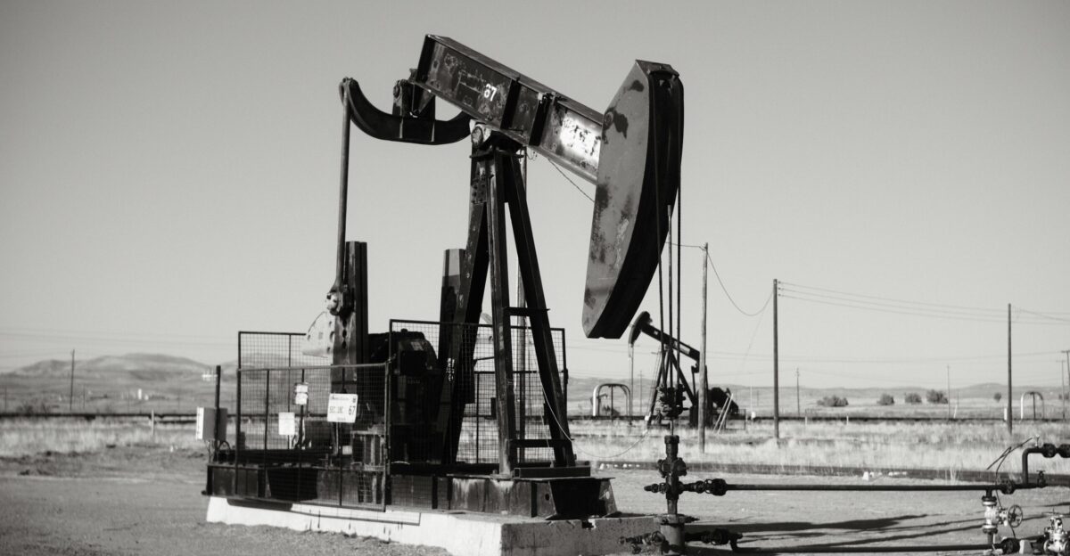 a black and white photo of an oil pump