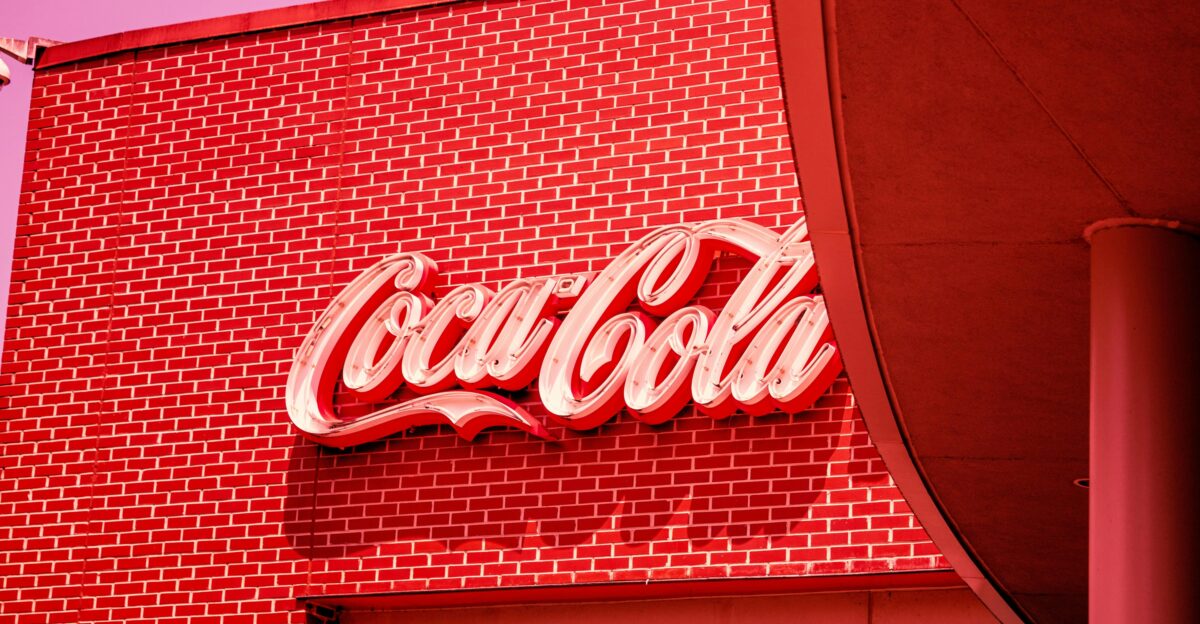 a red brick building with a coca cola sign on it