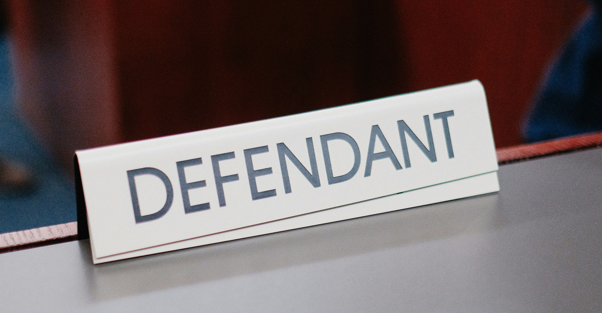 a desk with a sign on it that says defend