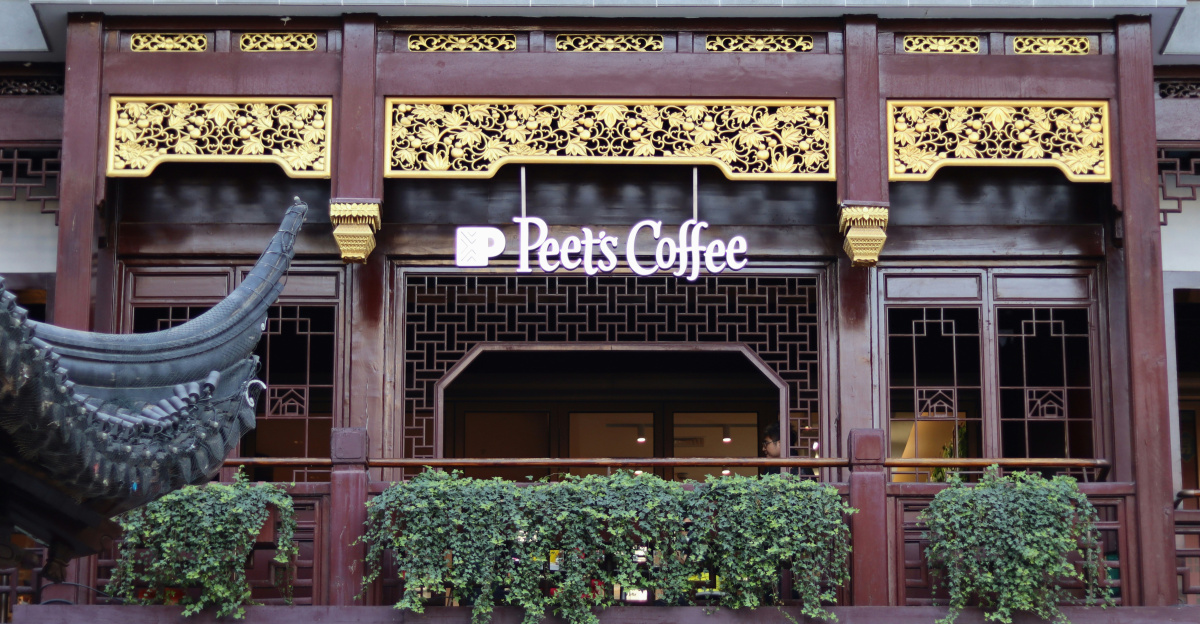 a building with a sign that says happy coffee on it