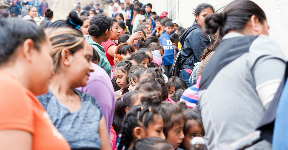 a large group of people are walking down a street