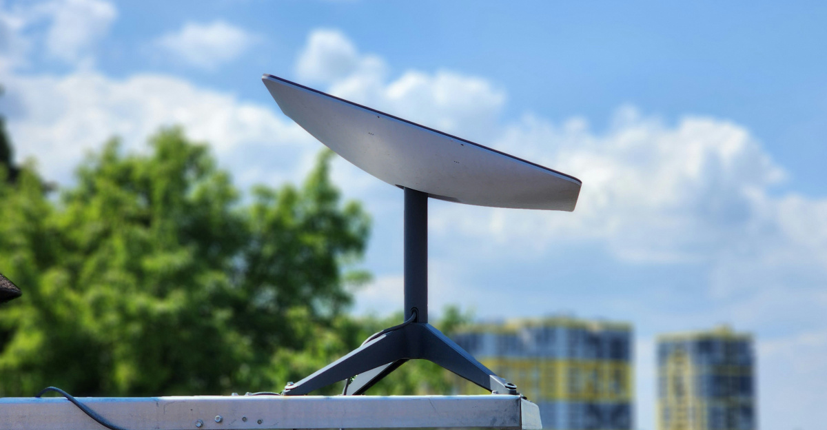 a white surfboard sitting on top of a metal pole