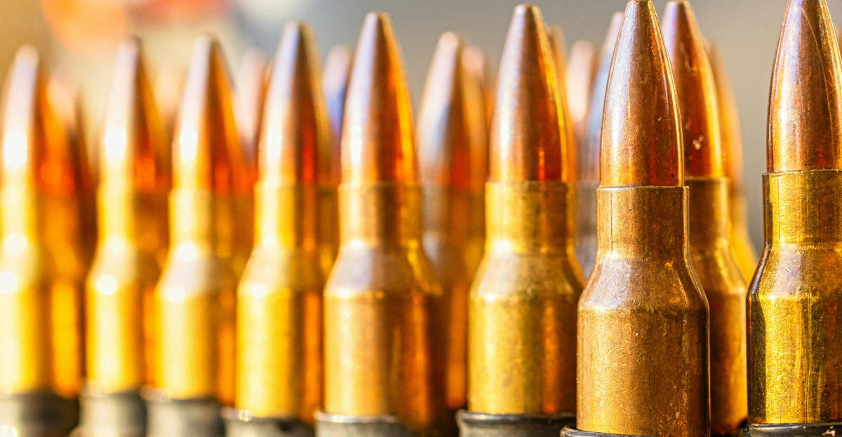 a bunch of bullet shells lined up on a table