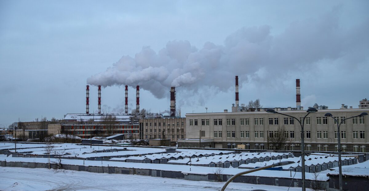 a factory with a lot of smoke coming out of it