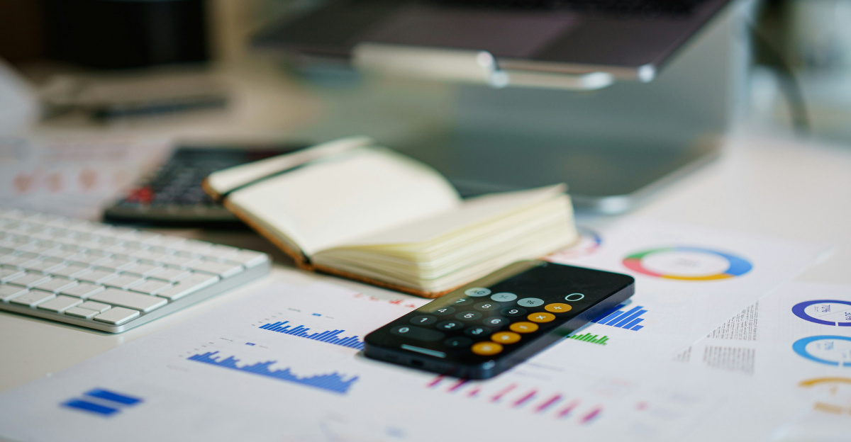 a remote control sitting on top of a table next to a book