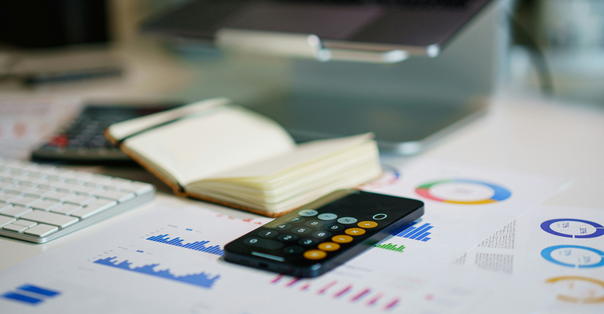 a remote control sitting on top of a table next to a book