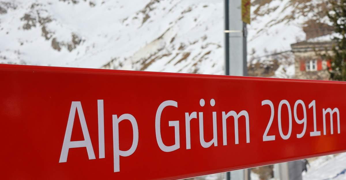 a group of people walking down a snow covered slope