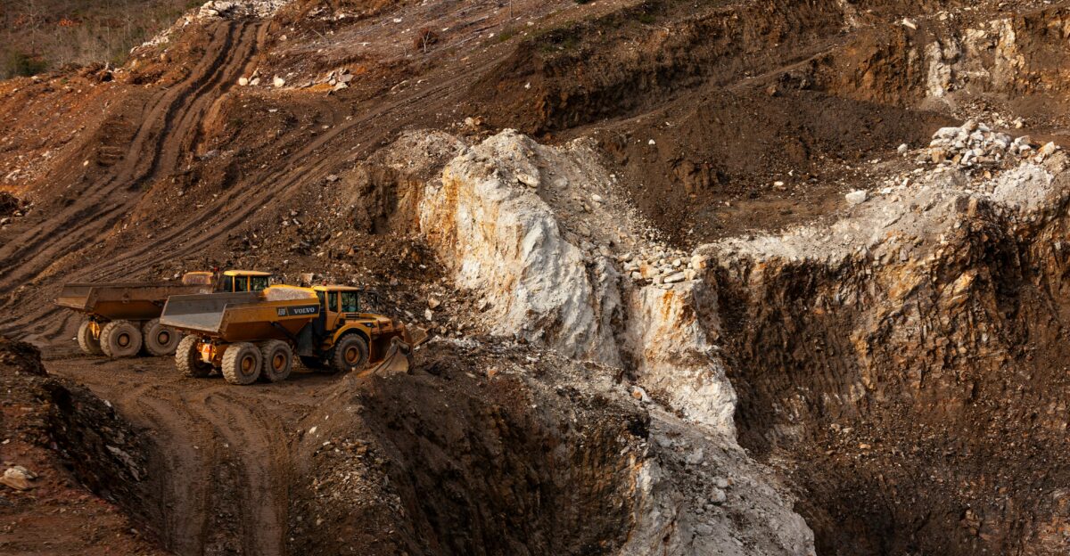 a large truck driving down a dirt road