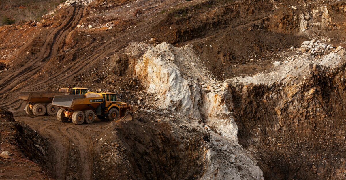 a large truck driving down a dirt road