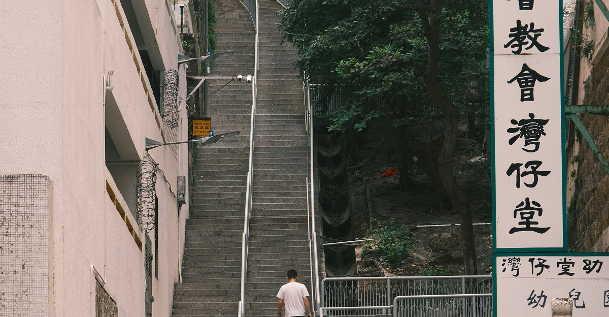 a man walking down a set of stairs