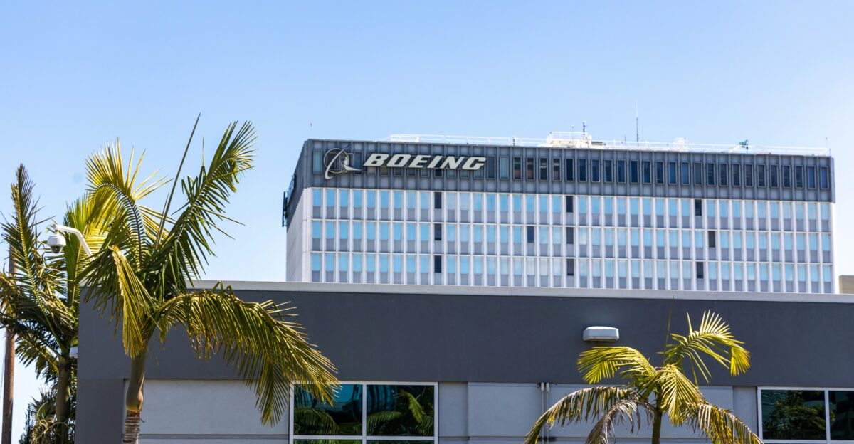 a building with palm trees in front of it