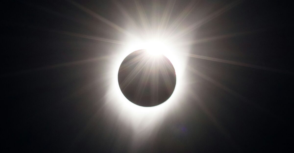 a solar eclipse is seen in the dark sky