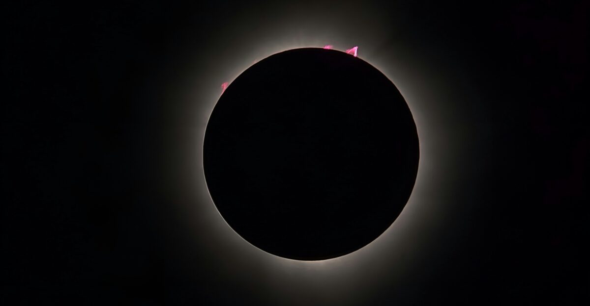 a solar eclipse is seen in the dark sky