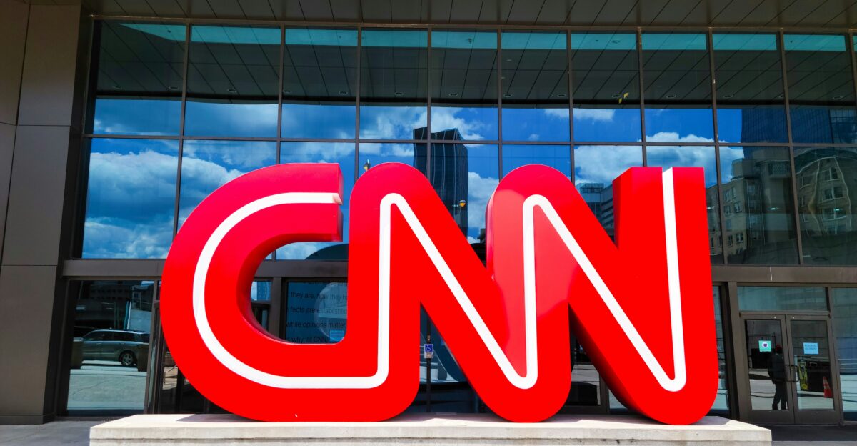 the cnn logo is displayed in front of a building