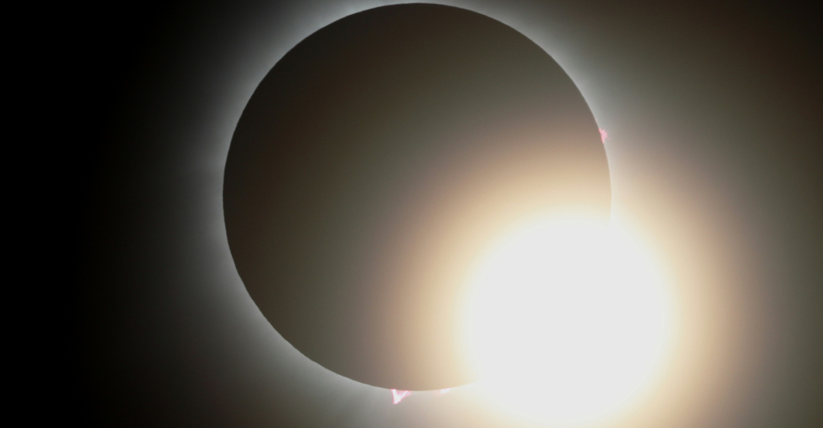 a solar eclipse is seen in the dark sky