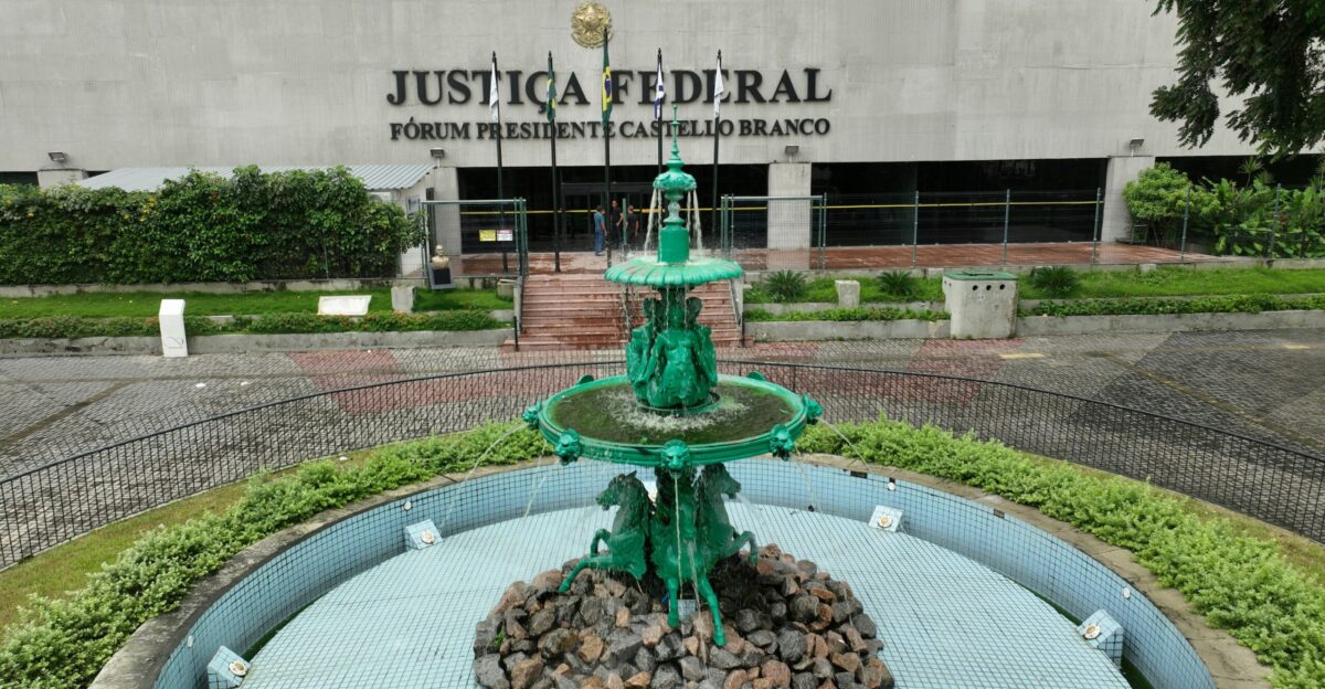 a green fountain in front of a building