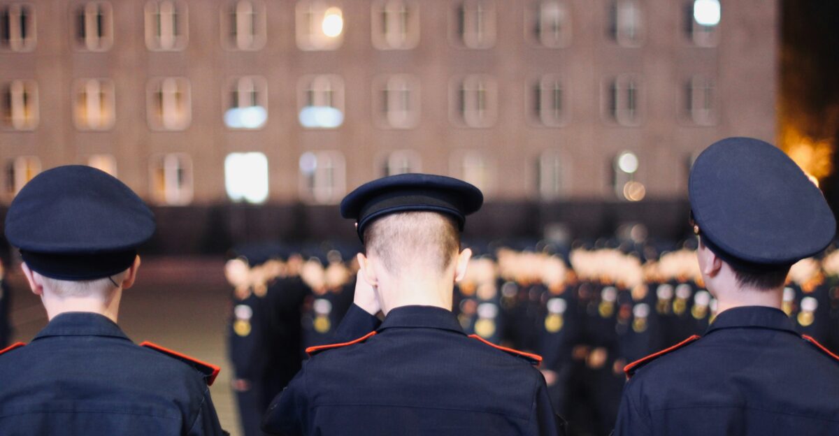 a group of uniformed men standing next to each other