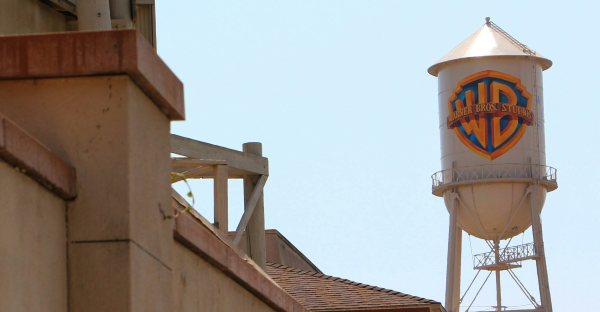 a tall water tower sitting next to a building