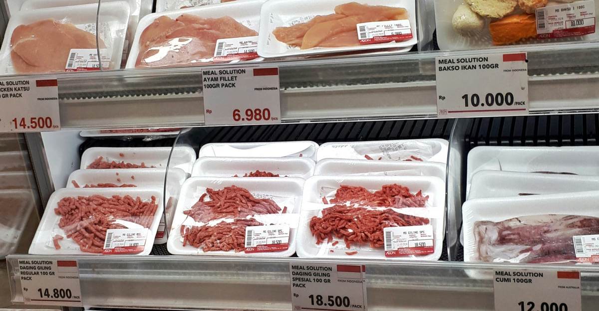 A display case filled with lots of different types of meat