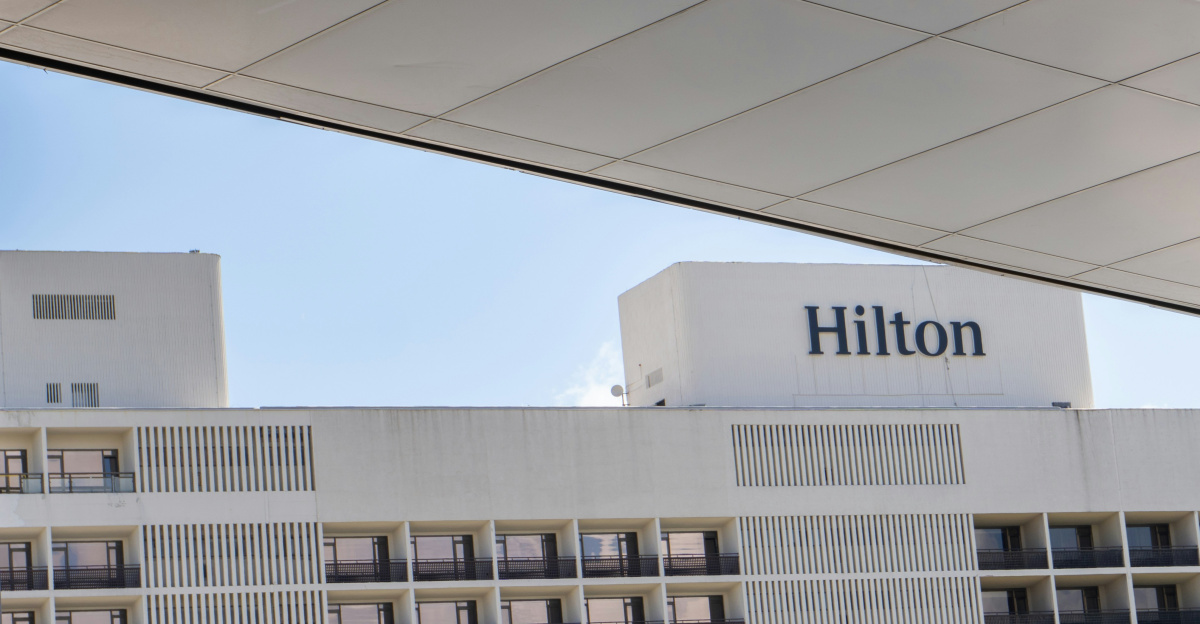 A hotel with a large white building in the background