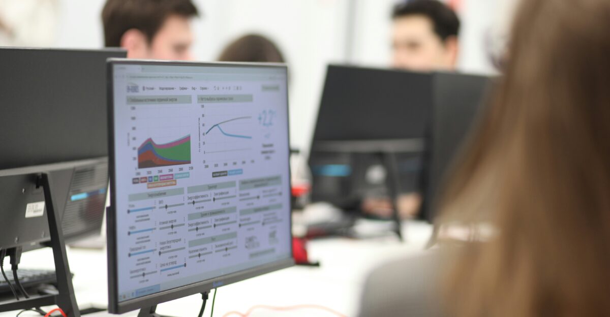 A group of people working on computers in a room
