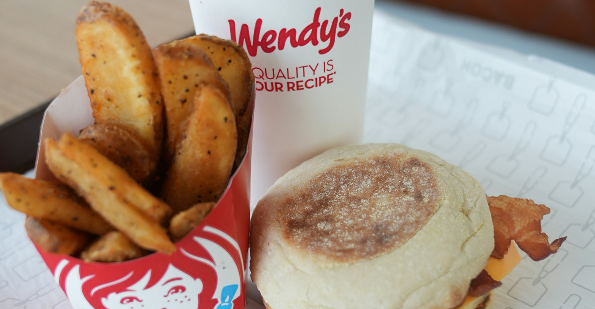 A tray with a sandwich and fries on it