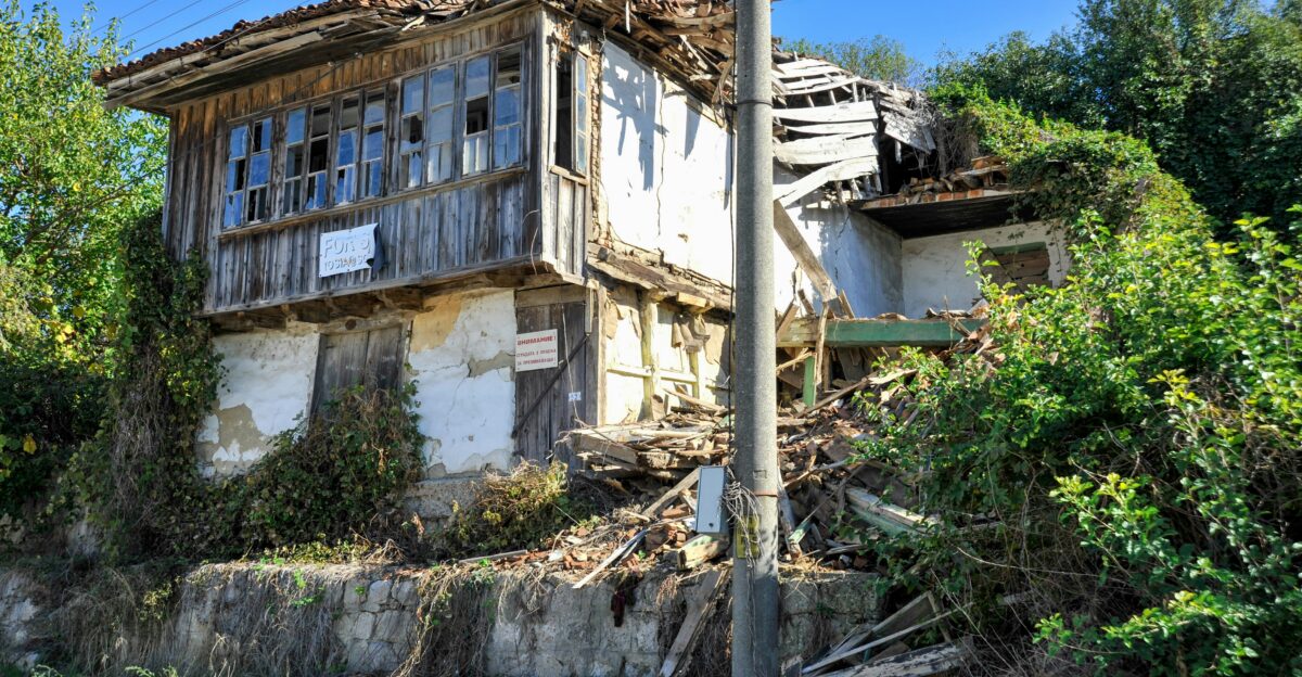 A run down house sitting on top of a hill