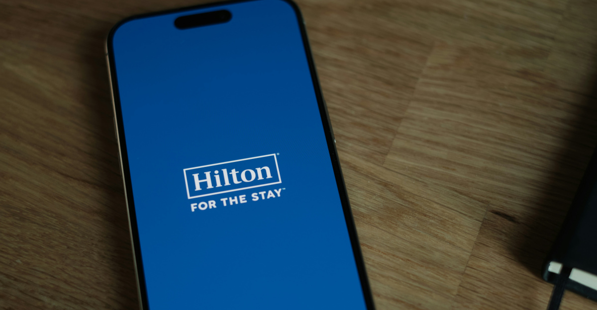 A cell phone sitting on top of a wooden table
