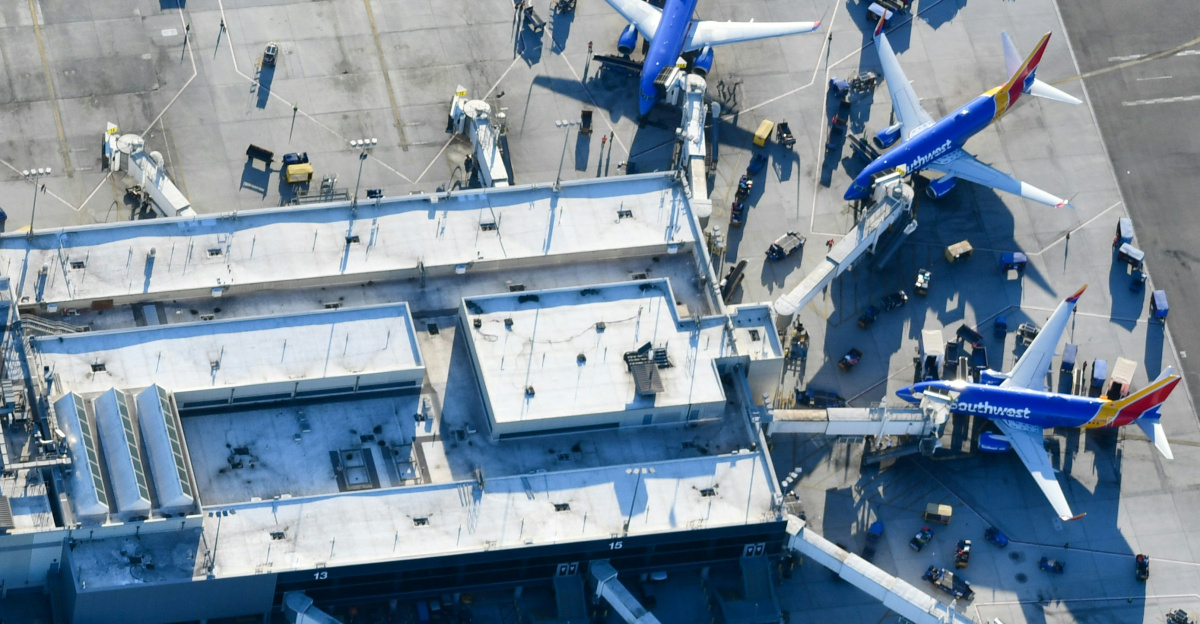An aerial view of a blue and white airplane