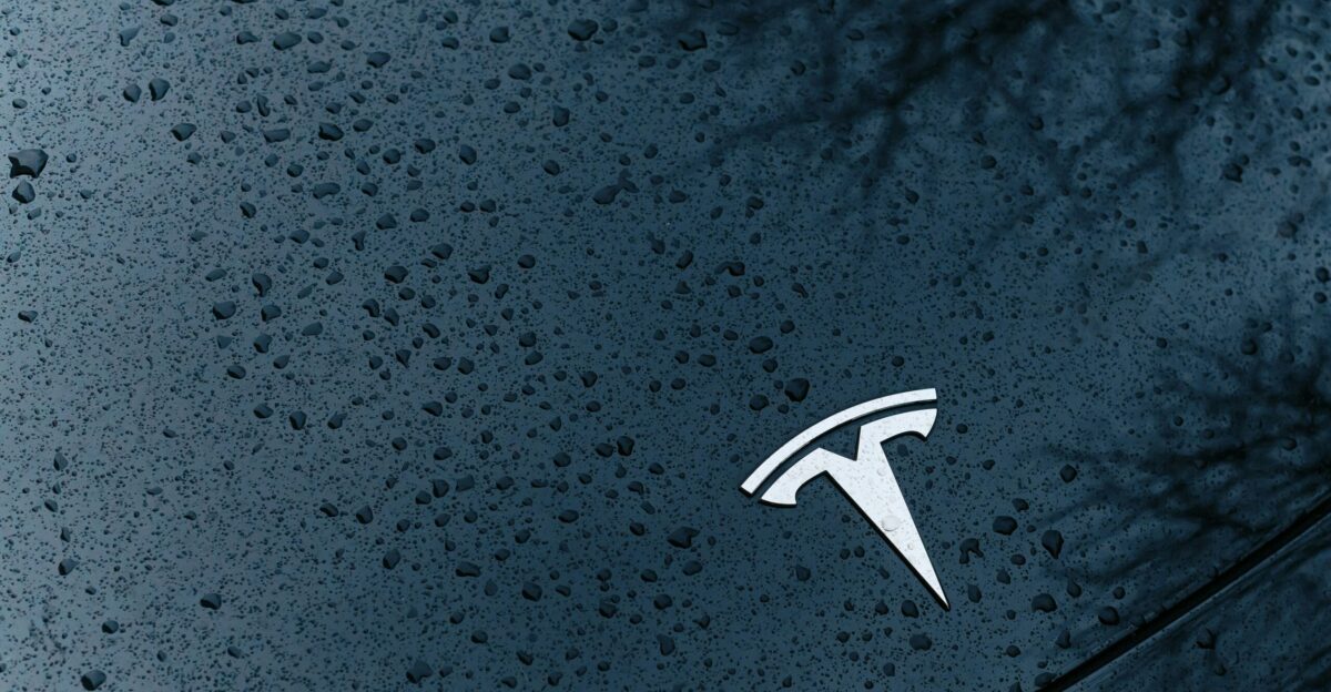 A close up of a car window with rain drops