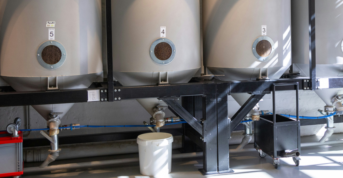 A bunch of tanks are lined up in a room